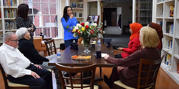 group sitting around table-Photo-from-Fred-article-1